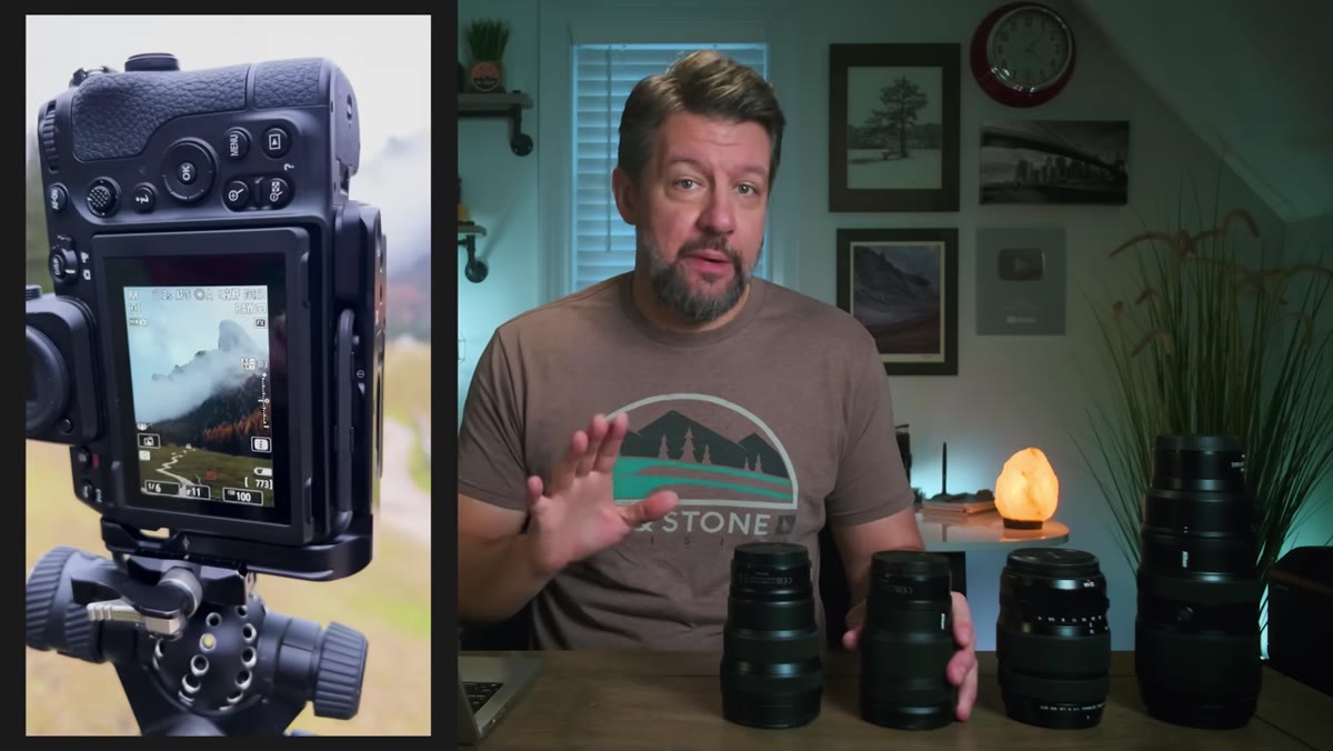 Mark Denney holding lens, explaining focal length philosophy