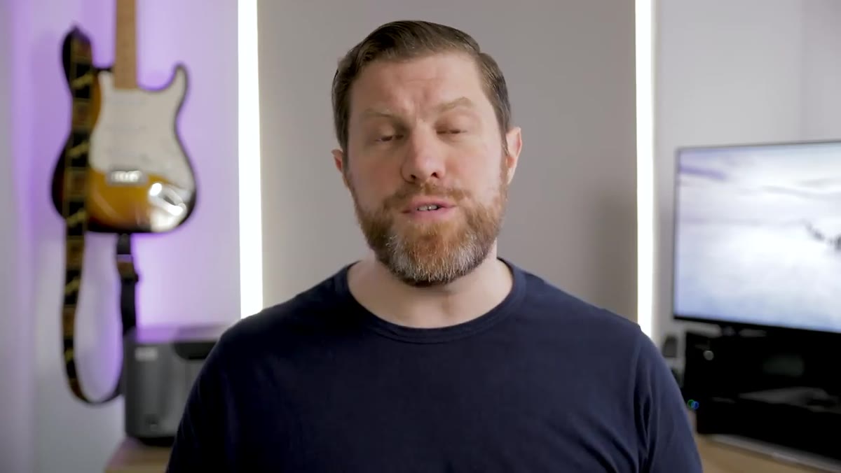 Host speaking to camera about photographer reputation and gear comments