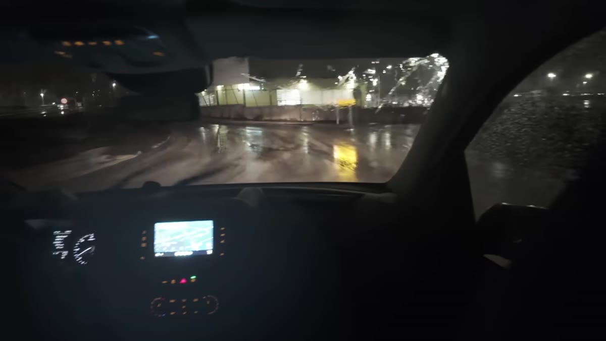 Heaton arriving at a location in driving rain and poor visibility