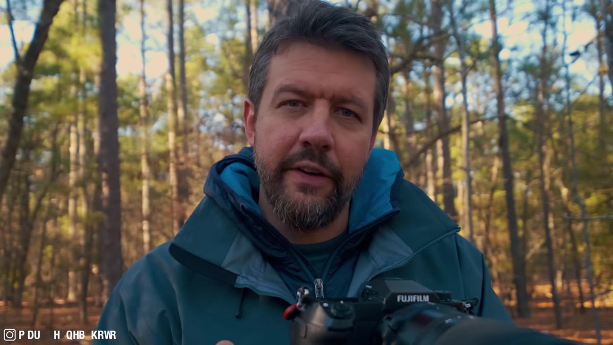 Photographer reviewing exposure on camera LCD screen