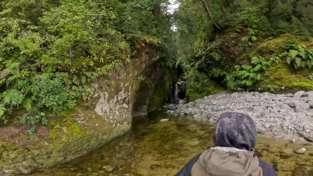 Narrow gorge with a 4-metre vertical waterfall blocking the path forward