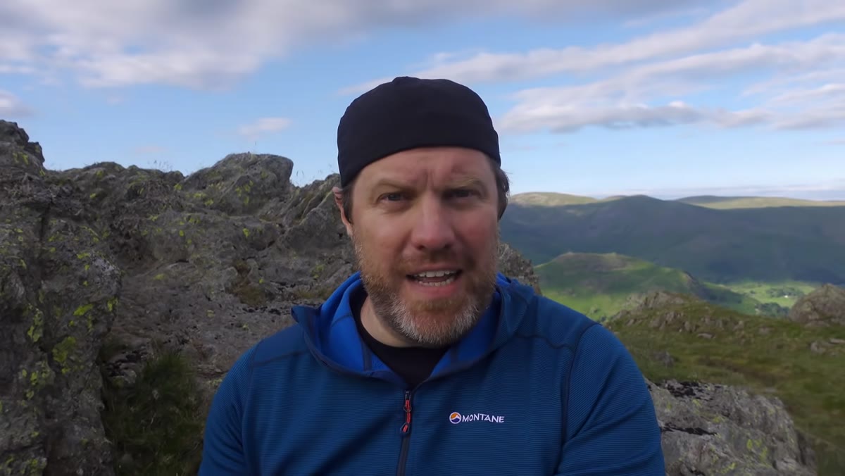 Adam on mountaintop describing confidence returning after the climb